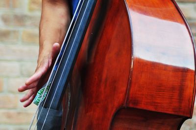 Midsection of person playing violin