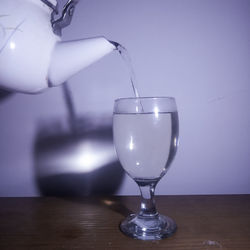 Close-up of wineglass on table