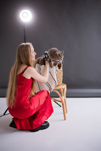 Side view of woman with dog