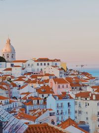 High angle view of lisbon townscape against sunset 