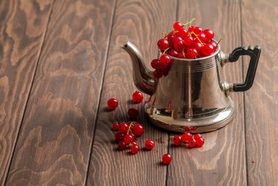 High angle view of red berries on table