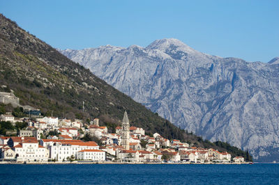 Scenic view of mountains against clear blue sky