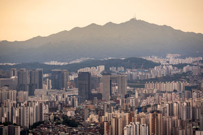 High angle view of cityscape against sky during sunset