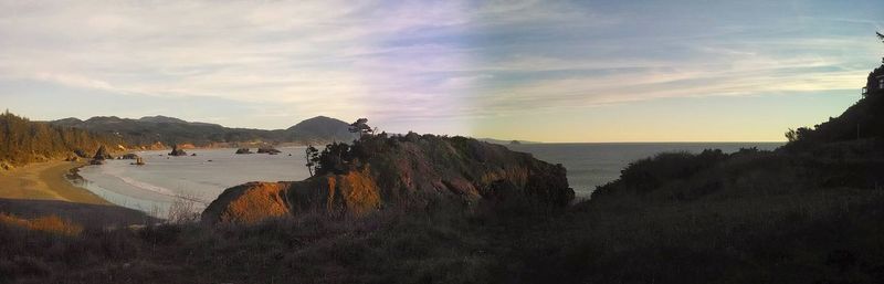 Panoramic view of beach against sky during sunset