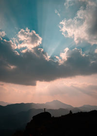 Low angle view of silhouette mountains against sky during sunset