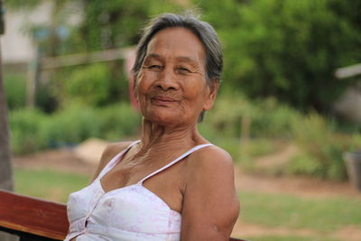 Portrait of smiling woman standing outdoors