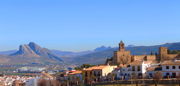 View of town against blue sky