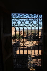Close-up of gate against window