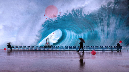 Digital composite image of people by swimming pool against sky