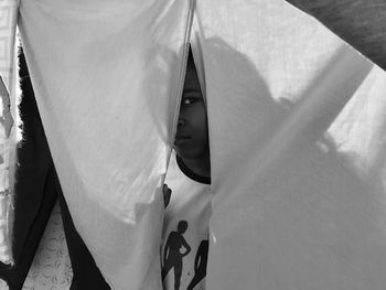 Peeking hide and seek hide sheets drapes black girl black monochrome photography