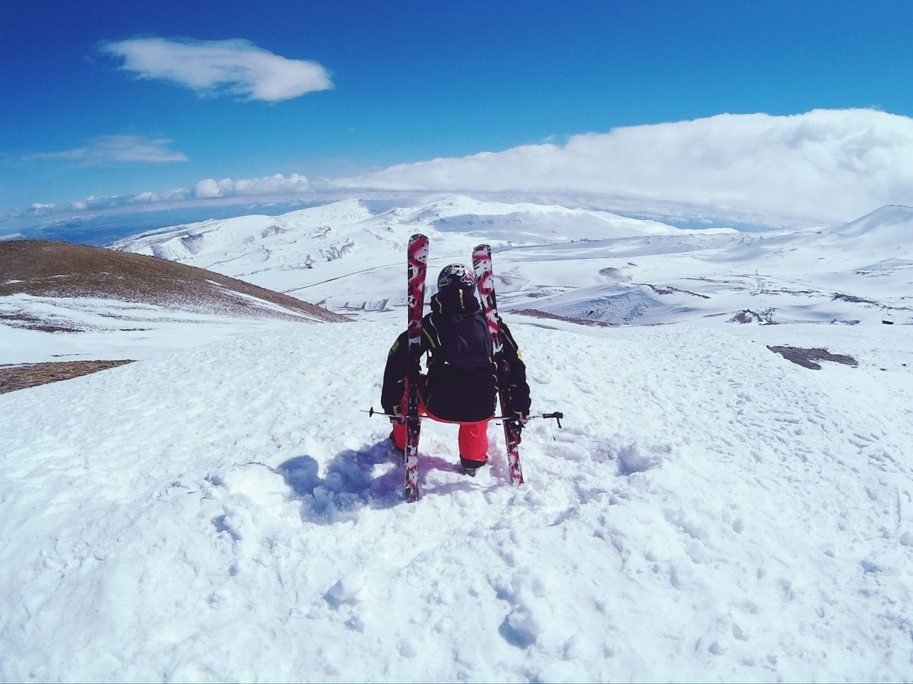 snow, winter, cold temperature, season, mountain, weather, leisure activity, lifestyles, landscape, warm clothing, snowcapped mountain, full length, tranquil scene, men, sky, scenics, tranquility, rear view