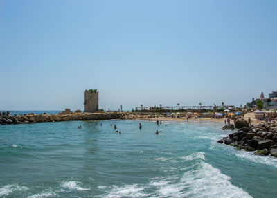 Scenic view of sea against clear blue sky