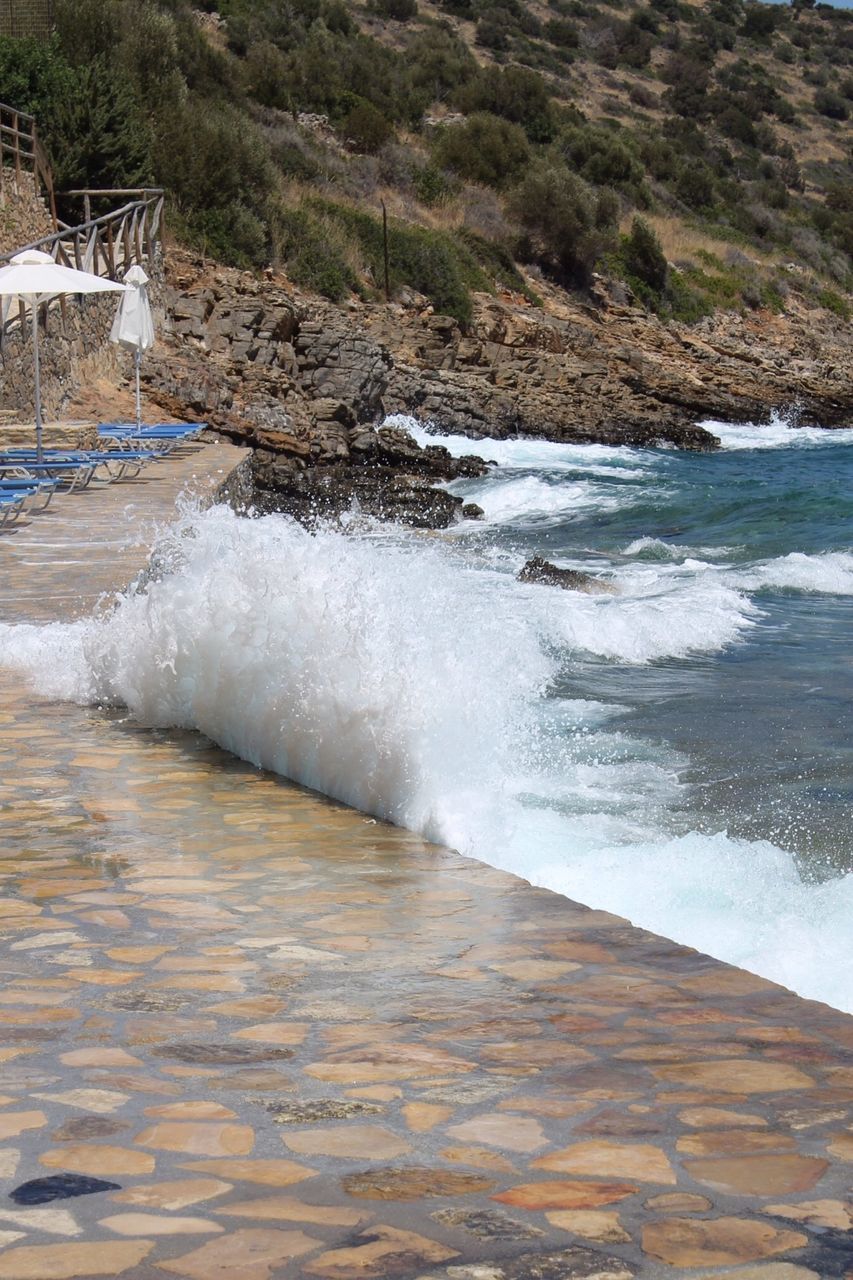 water, motion, surf, wave, splashing, flowing water, sea, beauty in nature, nature, flowing, scenics, long exposure, power in nature, rock - object, shore, beach, outdoors, day, waterfront, no people