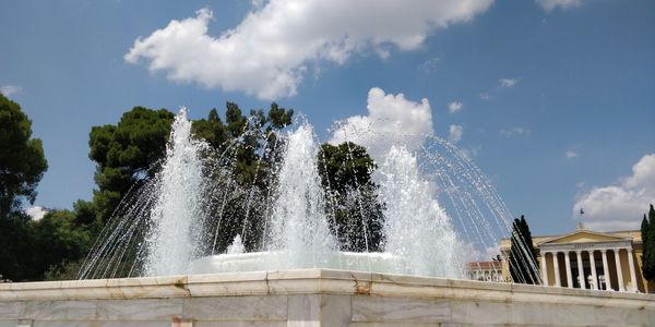 Panoramic view of waterfall against sky