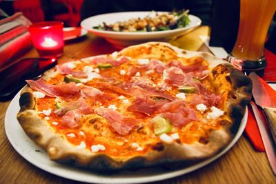 Close-up of pizza served on table