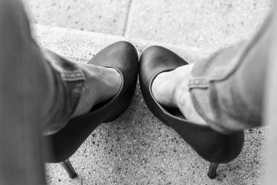 Low section of woman standing on tiled floor