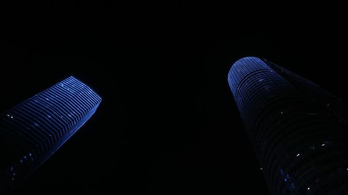 Low angle view of illuminated built structure at night