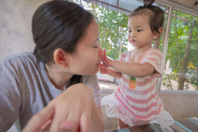 Mother and daughter outdoors