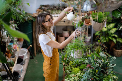 Woman standing by food outdoors