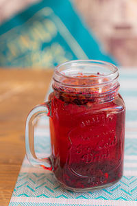 Close-up of drink in glass jar on table