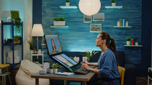 Woman using laptop at home