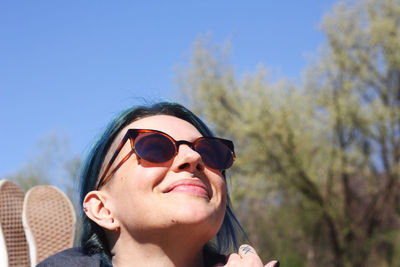 Portrait of man wearing sunglasses against sky