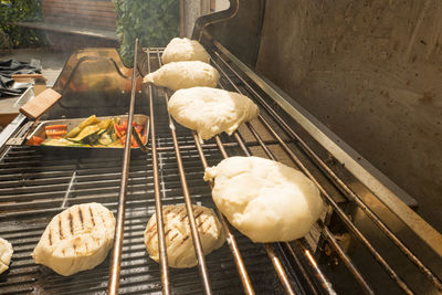 High angle view of meat on barbecue grill