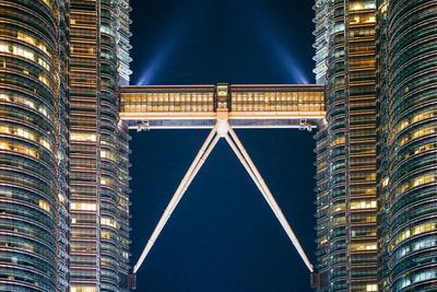 Illuminated petronas towers at night