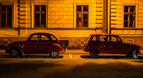 Bicycles parked on road against building