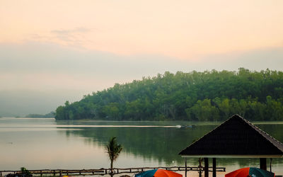 Scenic view of lake against sky during sunset