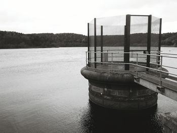 View of pier over calm river