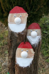 Close-up of stuffed toy on tree in field