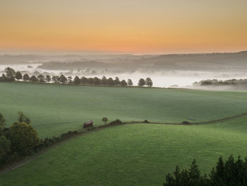 Scenic view of landscape against sky during sunset