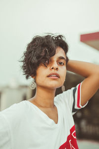 Portrait of beautiful young woman looking away