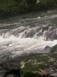 Close-up of water flowing in river