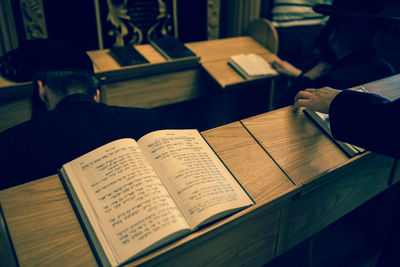 High angle view of jews praying with holy books