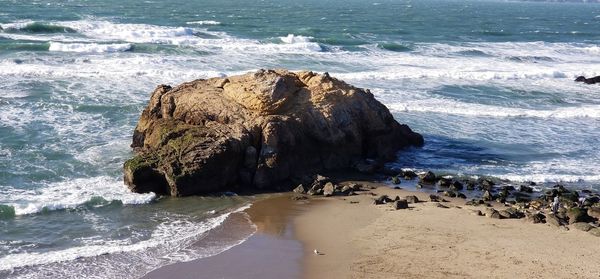 Panoramic view of sea shore at beach against sky