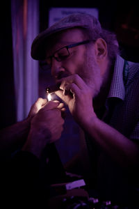 A man smoking cigar 