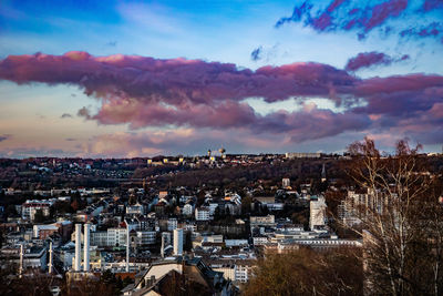 High angle shot of townscape against sky at sunset