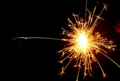 Close-up of firework display at night