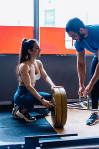 Side view of man exercising in gym