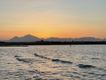 Scenic view of sea against sky during sunset