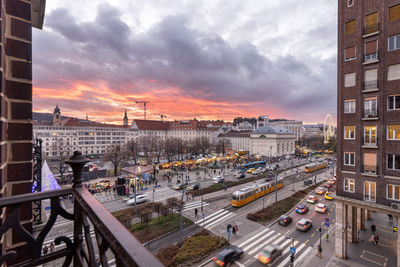 View to madach square towards deák ferenc tér during christmas fair market in sunset.