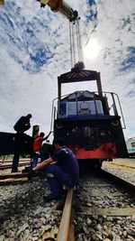 Train on railroad track against sky