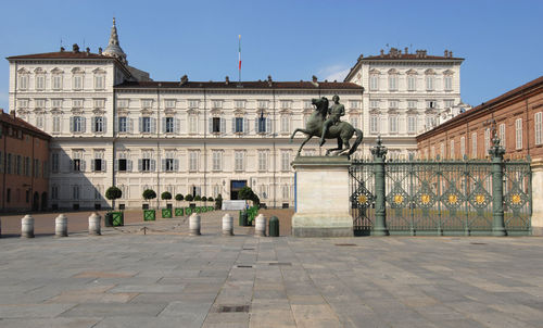 Statue in front of historical building