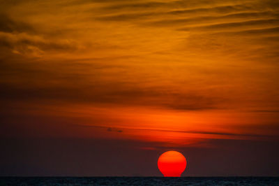 Scenic view of sea against romantic sky at sunset