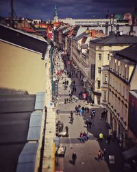 High angle view of crowd in city against sky