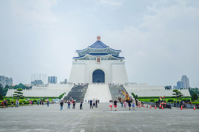 Group of people in front of historical building