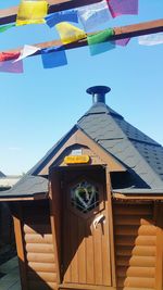 Low angle view of built structure against clear blue sky