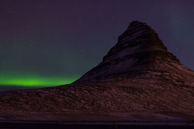 Low angle view of mountain against sky at night